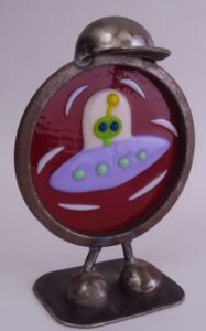 fused glass space ship in whimical frame