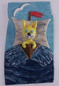 ceramic painting of cat in sailboat
