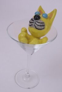 yellow cat in wine glass
